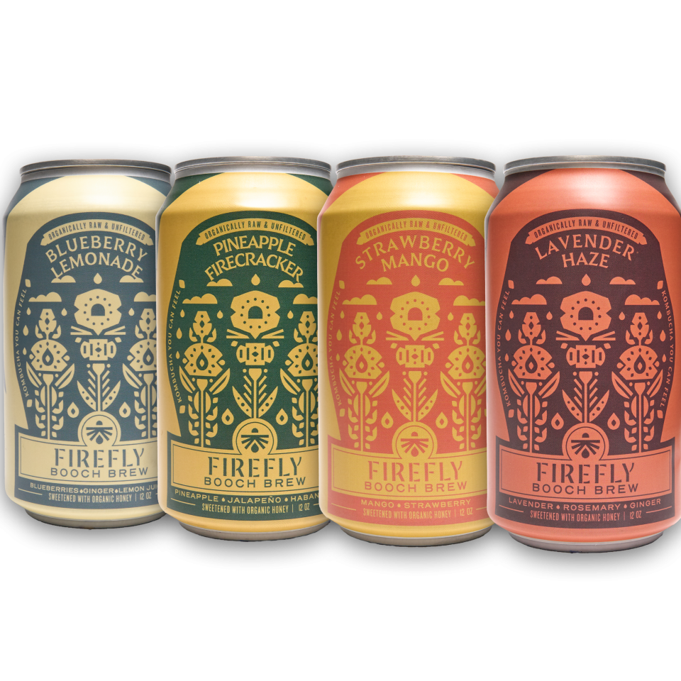 Four cans of Firefly Brew kombucha featuring different flavors.