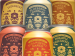 Six colorful cans of Firefly Brew's kombucha flavors in a stacked display.